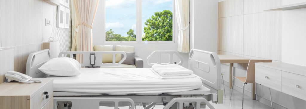 A private patient exam room in a hospital that shows the importance of mindful healthcare construction.